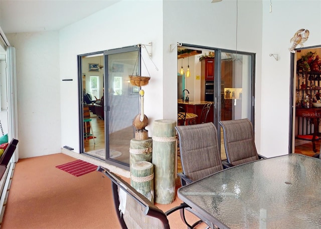 dining area featuring carpet