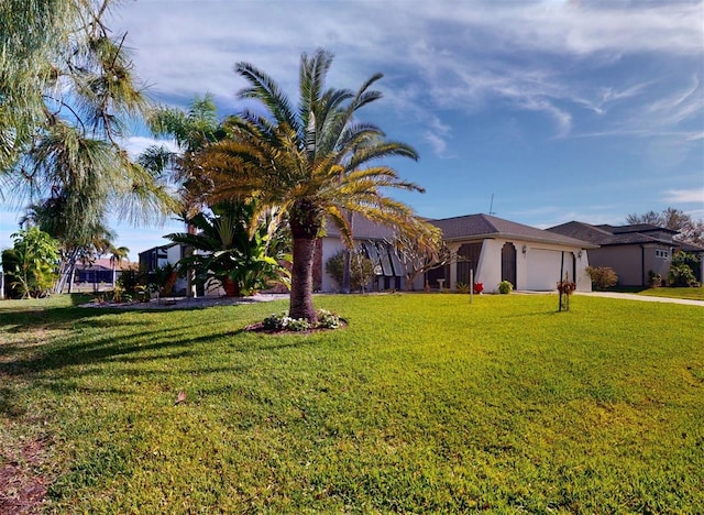 view of front of house with a front lawn and a garage