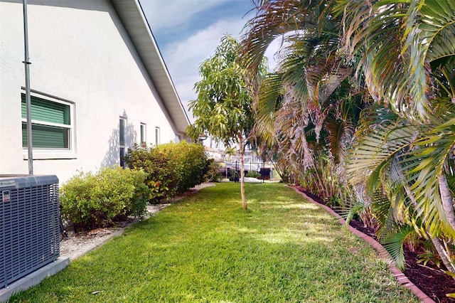 view of yard featuring central AC