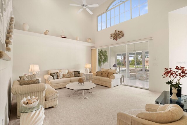 3800 Bal Harbor Blvd Unit 312, Punta Gorda, FL 33950 - living room featuring ceiling fan, a high ceiling, and carpet floors