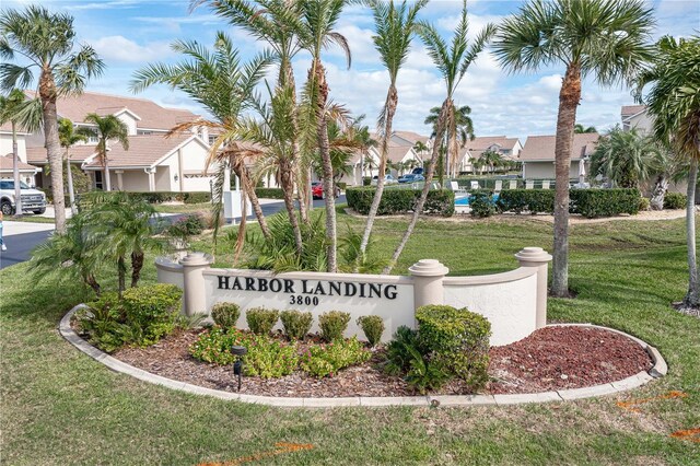 3800 Bal Harbor Blvd Unit 312, Punta Gorda, FL 33950 - community / neighborhood sign featuring a lawn and a residential view