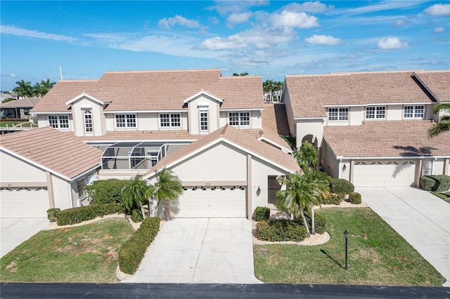 3800 Bal Harbor Blvd Unit 312, Punta Gorda, FL 33950 - view of front of house with concrete driveway, stucco siding, a residential view, and a tiled roof
