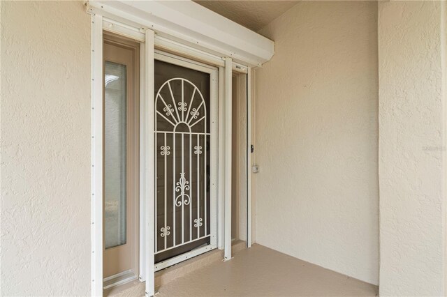 3800 Bal Harbor Blvd Unit 312, Punta Gorda, FL 33950 - property entrance with stucco siding