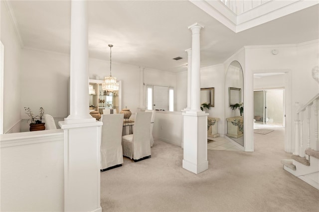 living room featuring light carpet, crown molding, and a notable chandelier