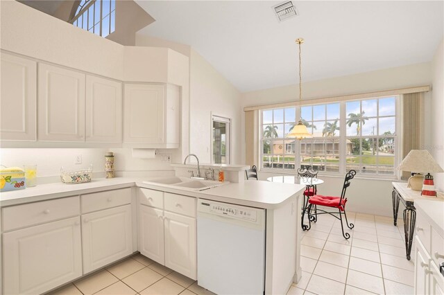 3800 Bal Harbor Blvd Unit 312, Punta Gorda, FL 33950 - kitchen featuring dishwasher, a sink, light tile patterned flooring, a peninsula, and vaulted ceiling