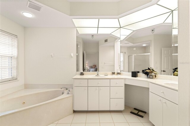 3800 Bal Harbor Blvd Unit 312, Punta Gorda, FL 33950 - ensuite bathroom featuring a shower stall, a bath, vanity, and tile patterned floors