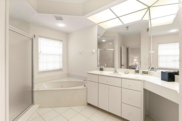 3800 Bal Harbor Blvd Unit 312, Punta Gorda, FL 33950 - bathroom featuring a stall shower, vanity, a bath, and tile patterned flooring