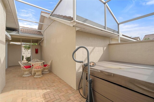 3800 Bal Harbor Blvd Unit 312, Punta Gorda, FL 33950 - view of patio / terrace with a hot tub and glass enclosure