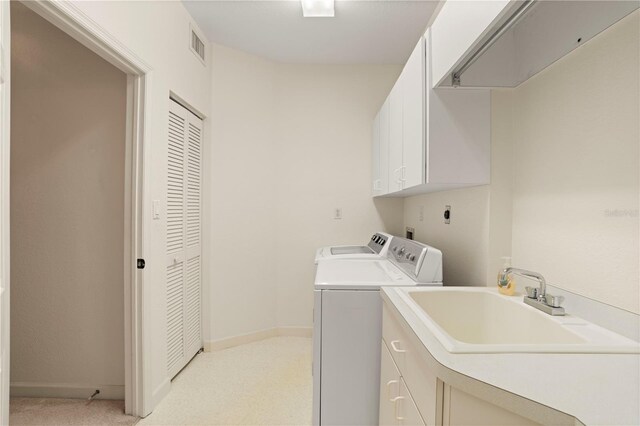 3800 Bal Harbor Blvd Unit 312, Punta Gorda, FL 33950 - laundry area featuring cabinet space, washing machine and dryer, and baseboards