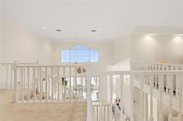 3800 Bal Harbor Blvd Unit 312, Punta Gorda, FL 33950 - hall with crown molding, carpet, a high ceiling, an upstairs landing, and recessed lighting