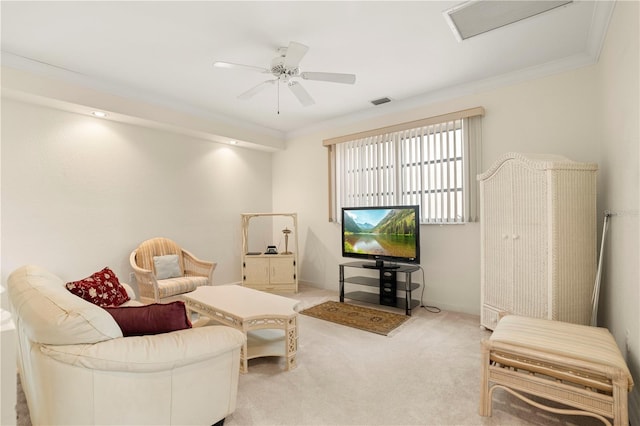 carpeted living room featuring ceiling fan and crown molding