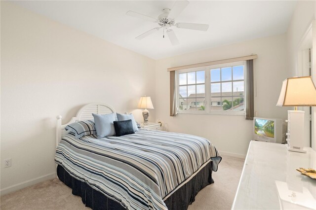 3800 Bal Harbor Blvd Unit 312, Punta Gorda, FL 33950 - carpeted bedroom featuring baseboards and a ceiling fan