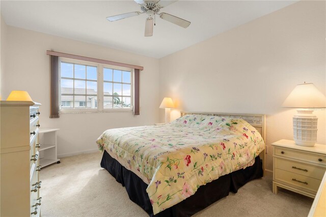 3800 Bal Harbor Blvd Unit 312, Punta Gorda, FL 33950 - bedroom featuring light carpet, baseboards, and ceiling fan