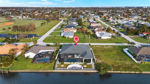 birds eye view of property with a water view