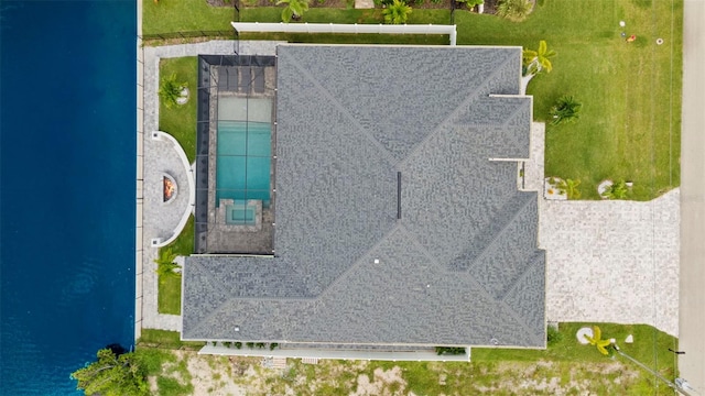 birds eye view of property with a water view