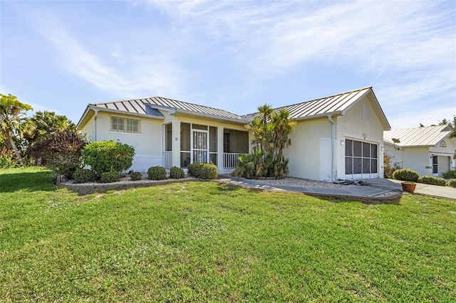 ranch-style home featuring a front lawn