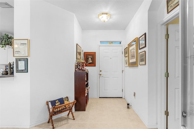 corridor with light tile patterned floors