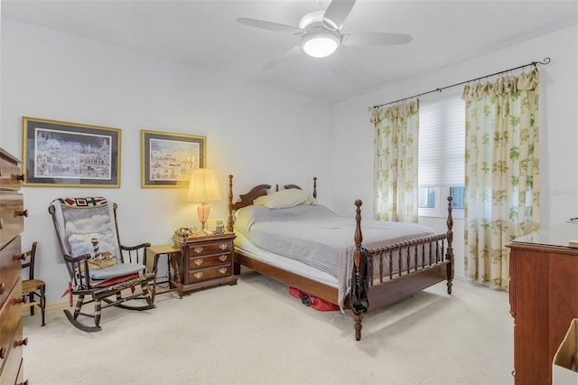 bedroom with ceiling fan and light carpet