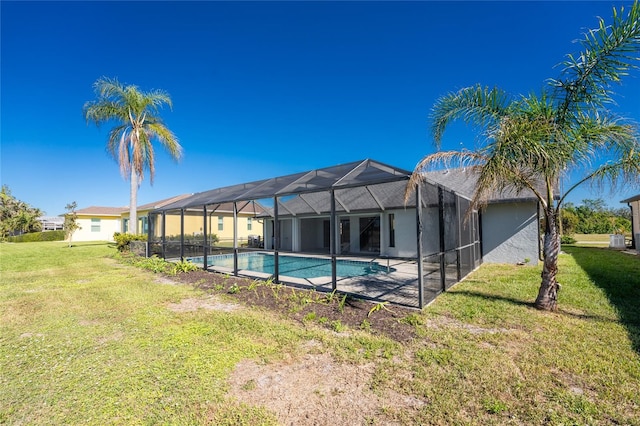 view of swimming pool with a lawn and glass enclosure