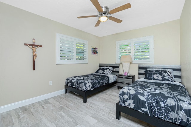 bedroom featuring ceiling fan and light wood-type flooring