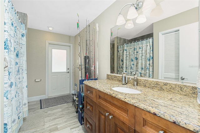 bathroom with vanity and hardwood / wood-style flooring