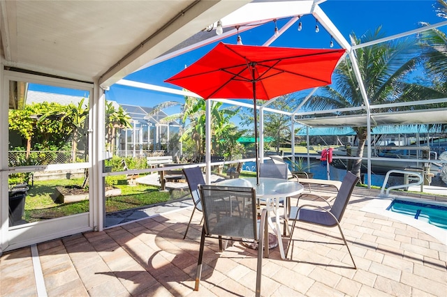 view of patio / terrace with a lanai