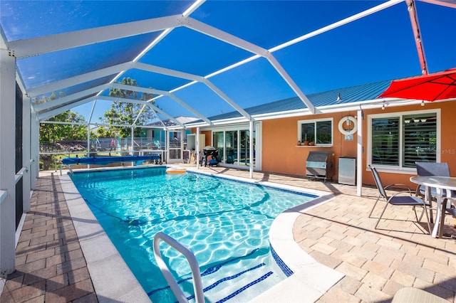 view of pool featuring a lanai and a patio area