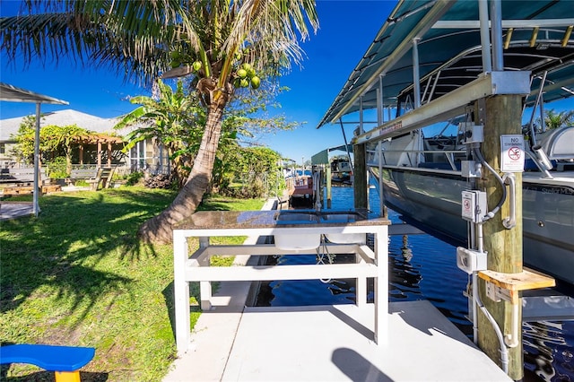 view of dock featuring a yard