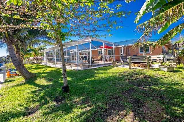 view of yard featuring a lanai, a patio, and a pool