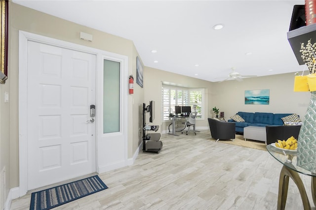 entryway with ceiling fan and light wood-type flooring