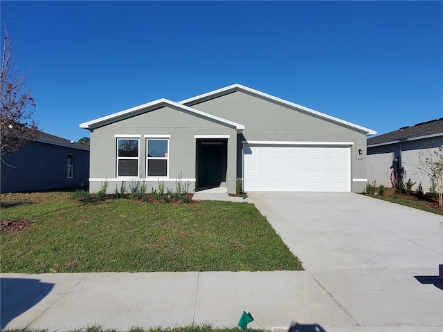 view of front facade featuring concrete driveway, an attached garage, a front yard, and stucco siding