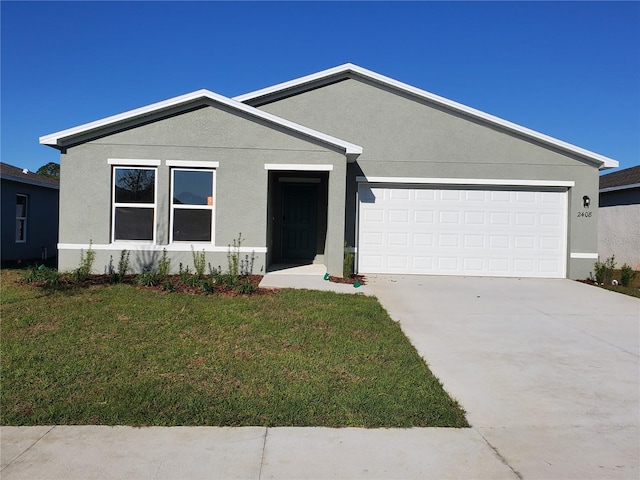 single story home featuring stucco siding, driveway, an attached garage, and a front yard