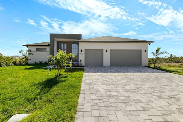 view of front facade with a front lawn and a garage