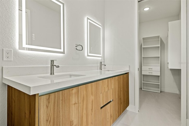 bathroom featuring tile patterned floors and vanity