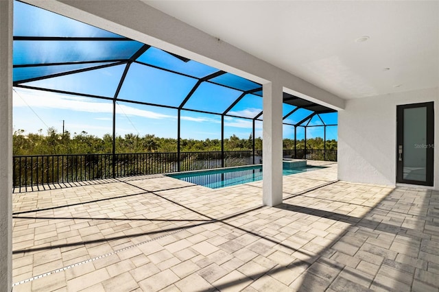 view of swimming pool featuring a lanai and a patio area