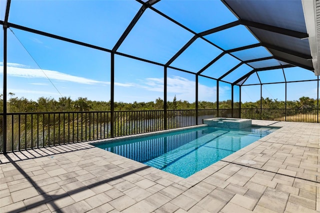 view of swimming pool featuring an in ground hot tub, a patio, a water view, and a lanai