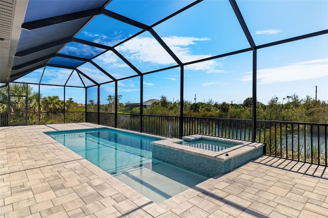 view of pool with a lanai, a patio area, an in ground hot tub, and a water view