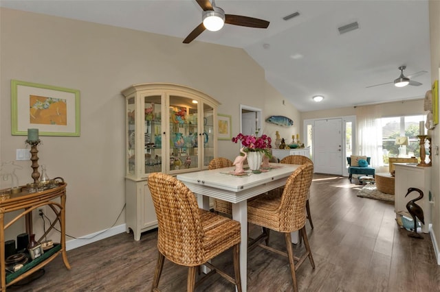 dining space with ceiling fan, dark wood-type flooring, and lofted ceiling