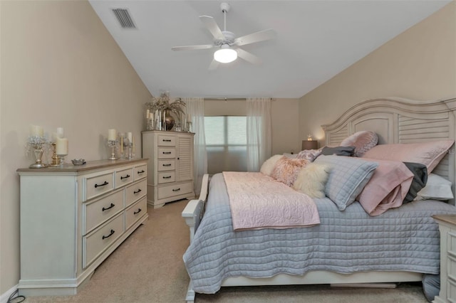 bedroom with light carpet, vaulted ceiling, and ceiling fan