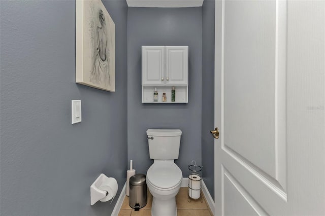 bathroom featuring tile patterned flooring and toilet