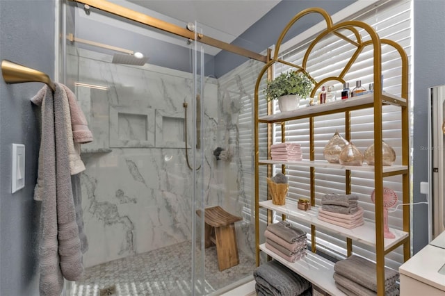 bathroom with a shower with shower door