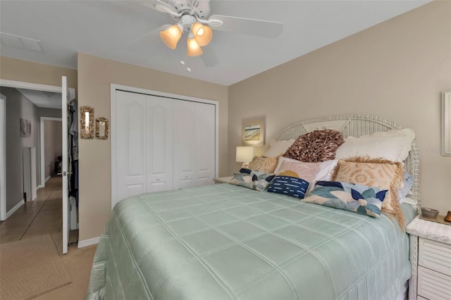 bedroom with ceiling fan and a closet