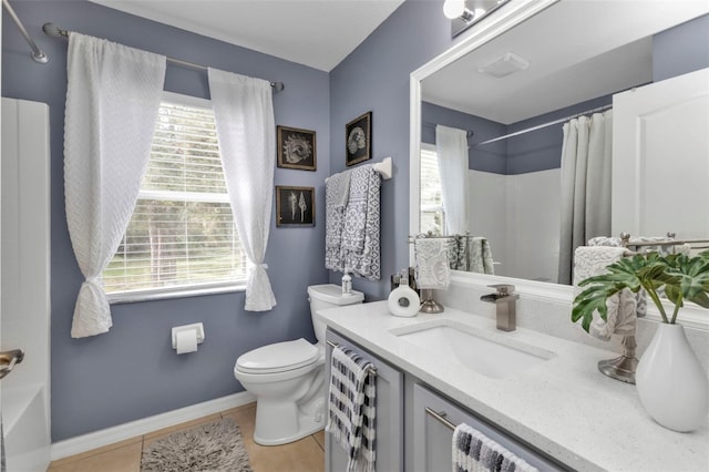 full bathroom with tile patterned floors, vanity, shower / tub combo, and toilet