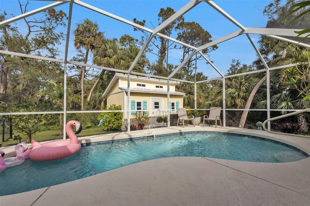 view of pool with a lanai and a patio