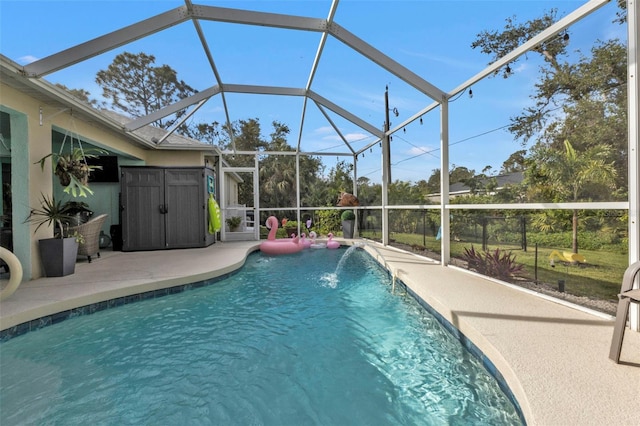 view of swimming pool featuring pool water feature, a lanai, and a patio area