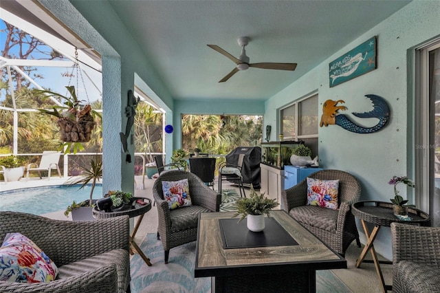 sunroom with ceiling fan