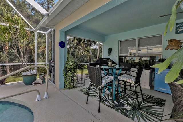 view of patio / terrace featuring a lanai