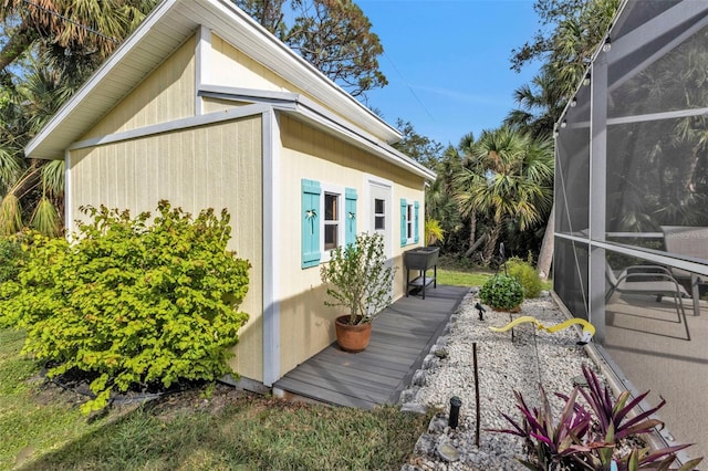 view of property exterior with a lanai