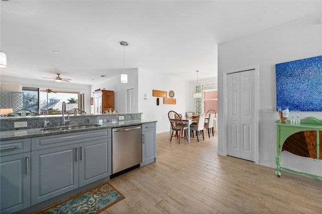 kitchen with dishwasher, sink, ceiling fan, gray cabinets, and decorative light fixtures