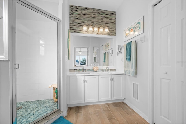 bathroom featuring vanity and walk in shower